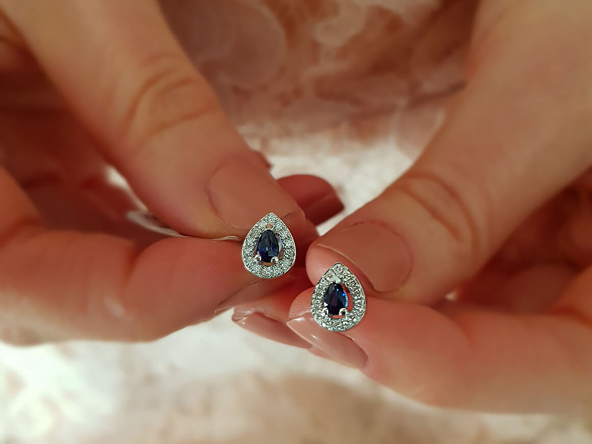 Diamond and teardrop sapphire stud earrings
