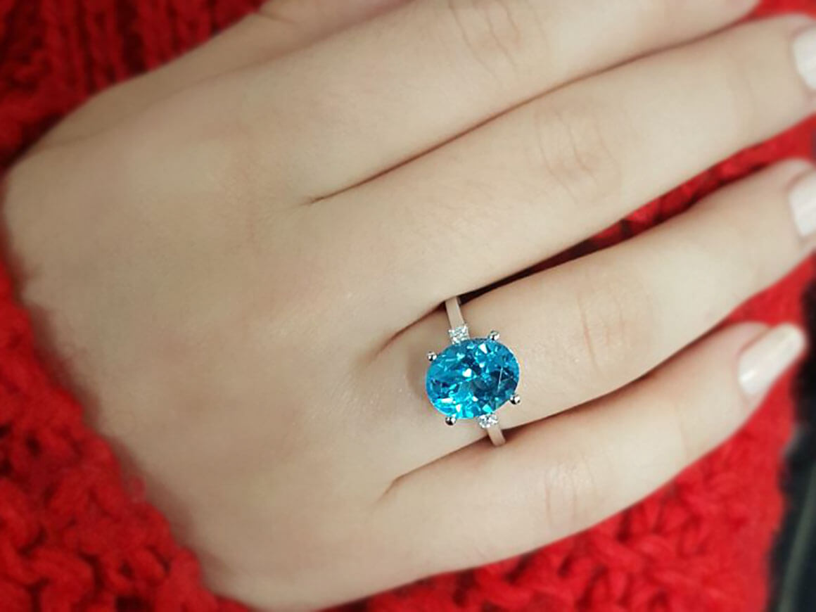 Diamond and Oval Blue Topaz Ring