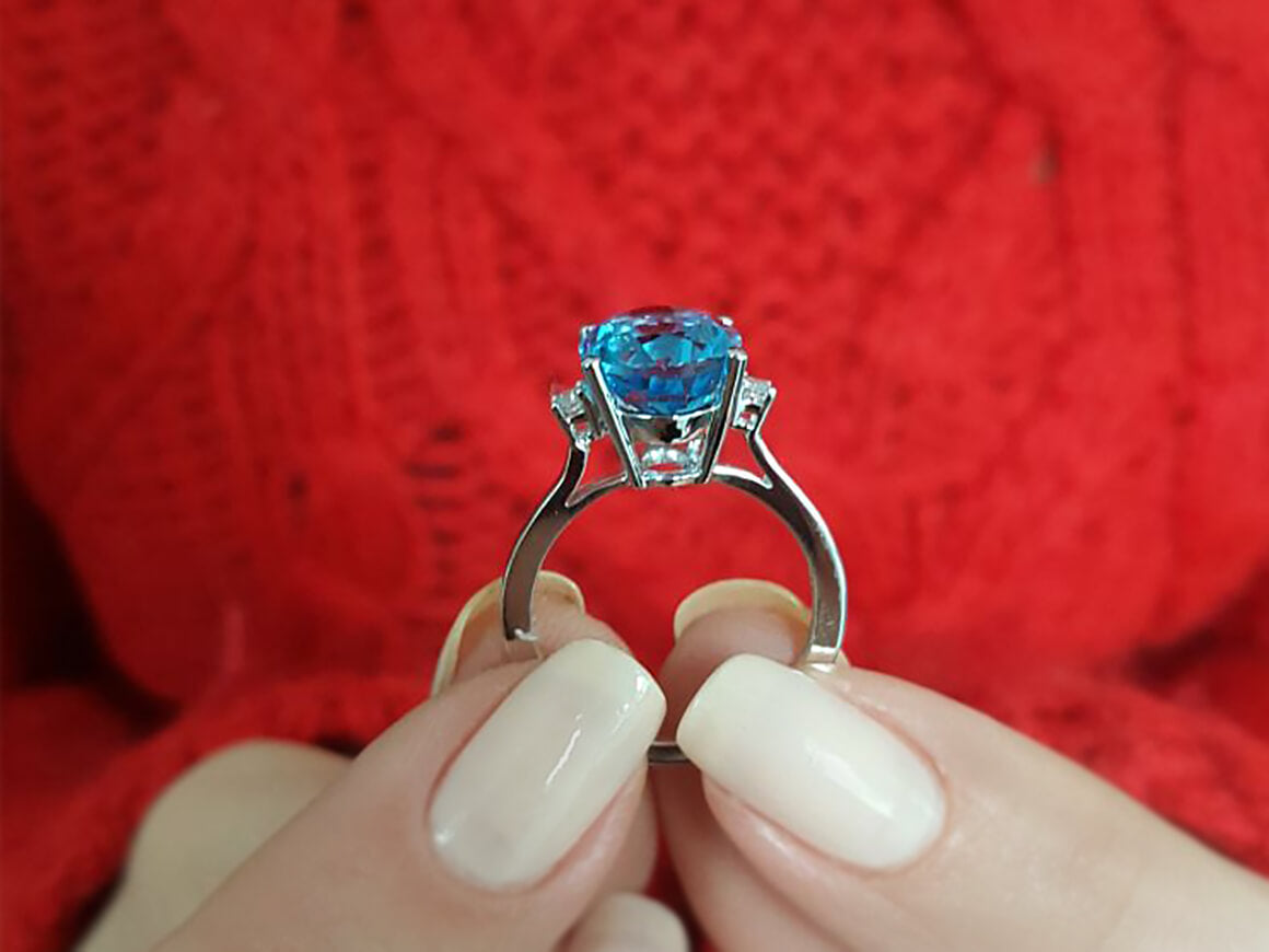 Diamond and Oval Blue Topaz Ring
