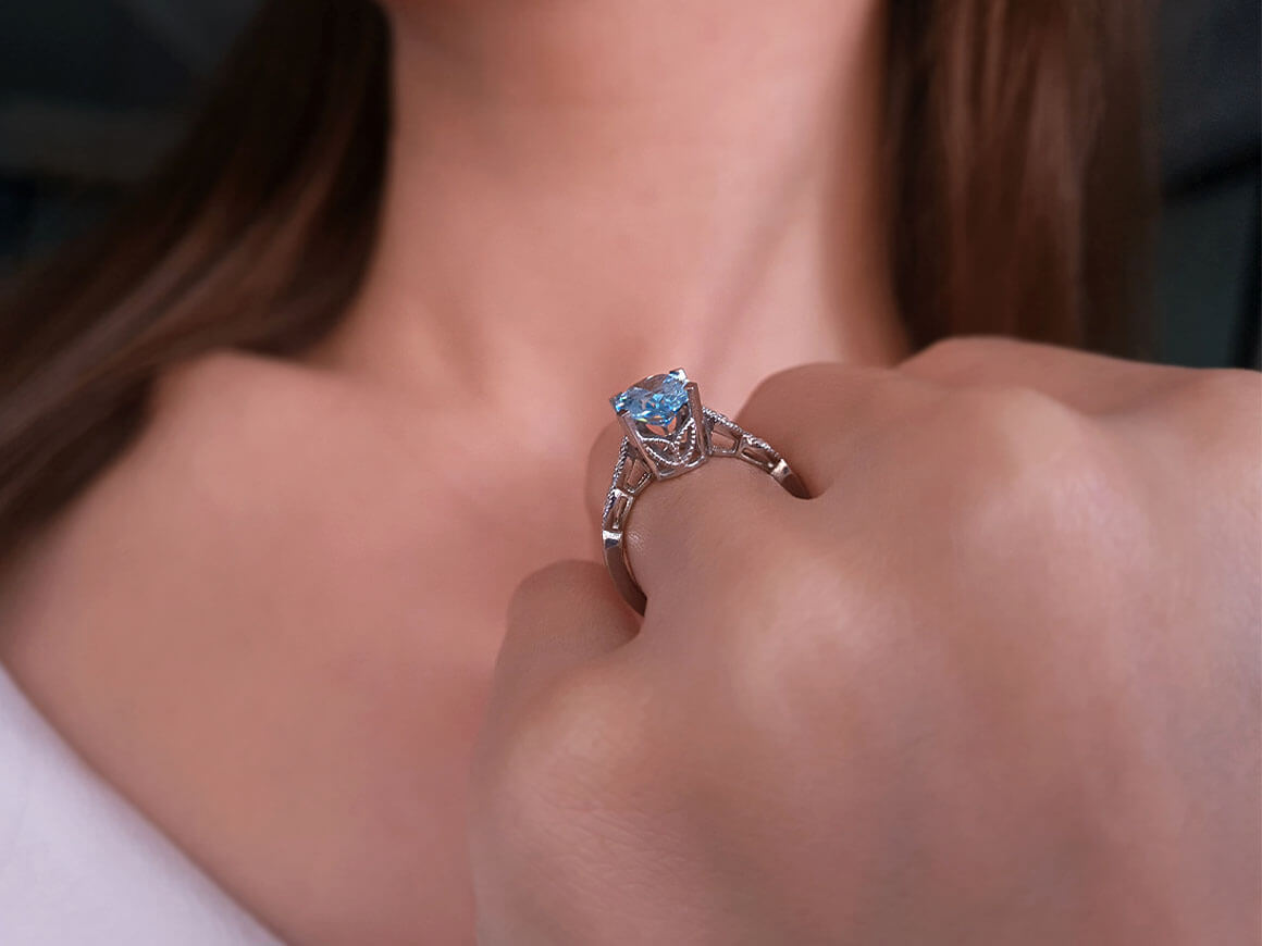 Diamond and Oval Blue Topaz Ring