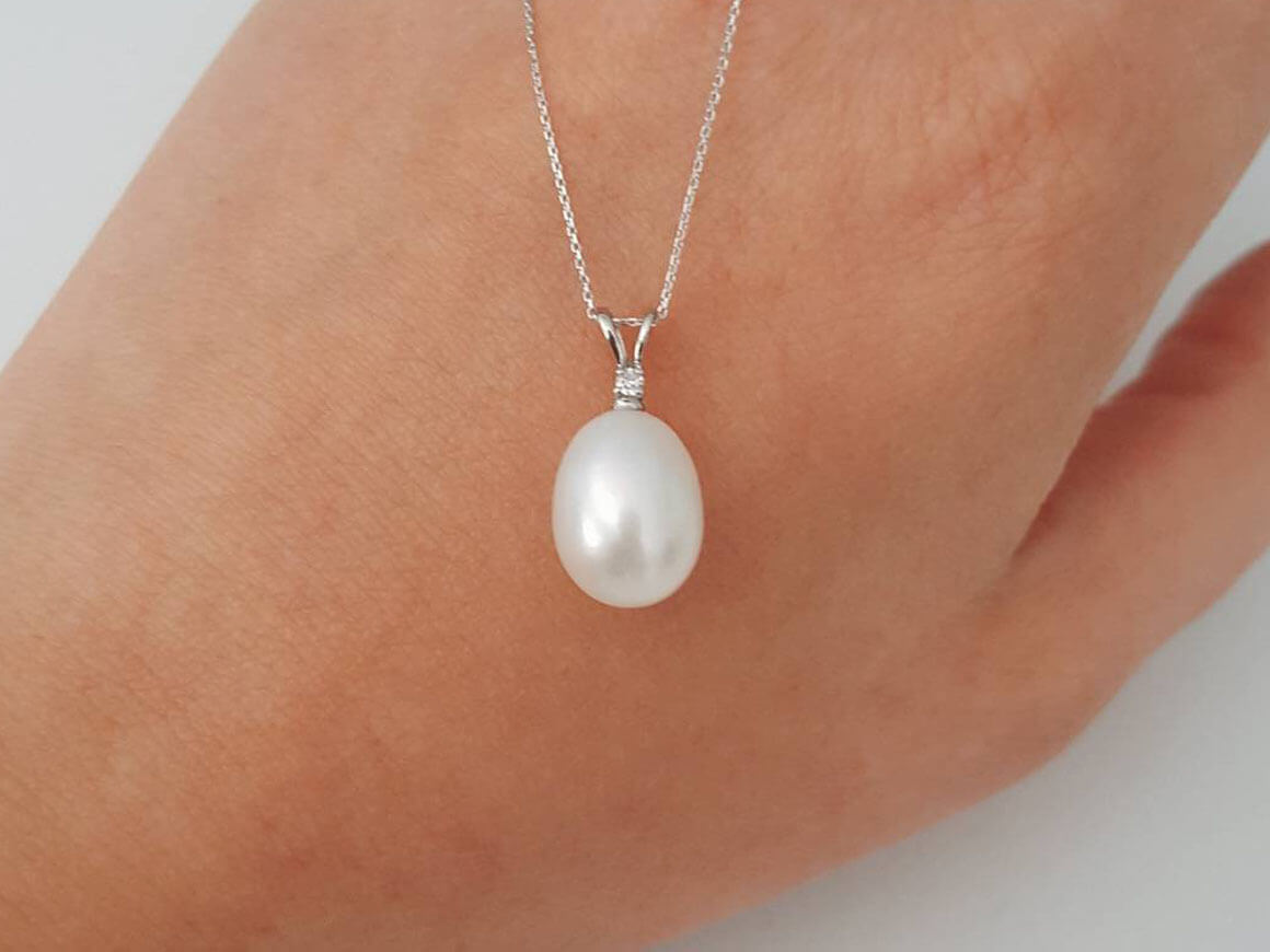 Diamond and drop pearl necklace