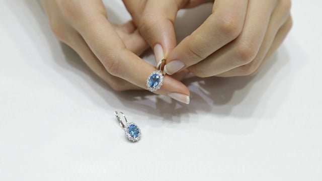Boucles d'oreilles pendantes en diamant et topaze bleue ovale