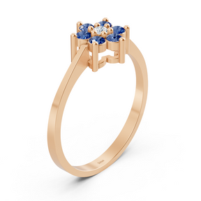 Eleganter Roségoldring mit Saphiren und Diamanten