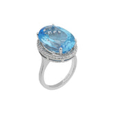 Bague diamant et topaze bleue ovale