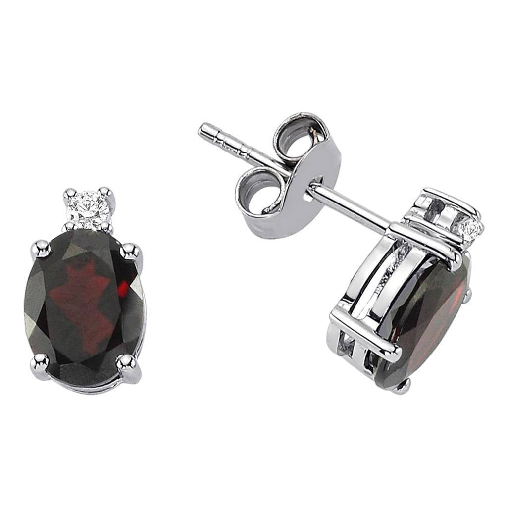 Boucles d'oreilles à tige en diamant et grenat ovale