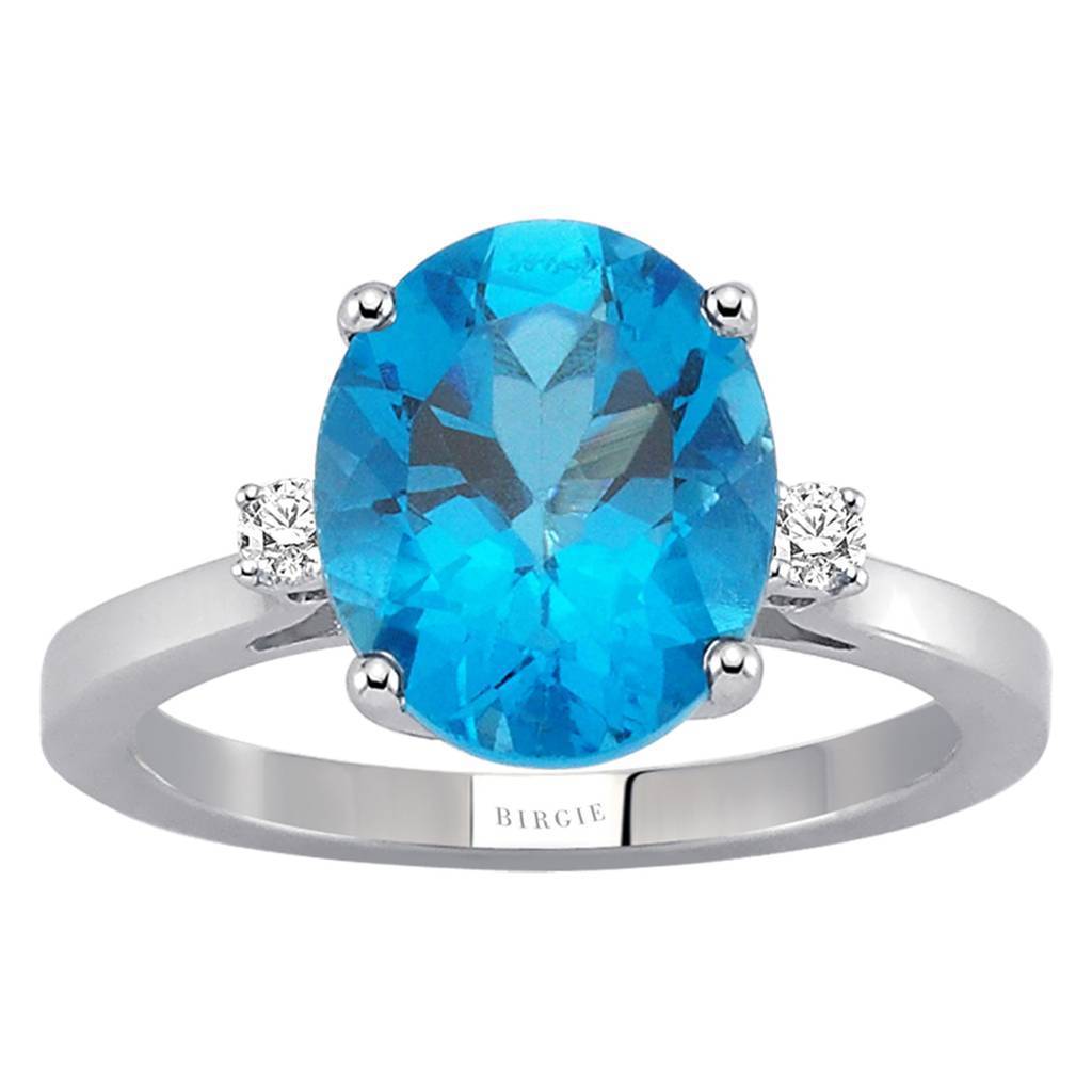 Diamond and Oval Blue Topaz Ring