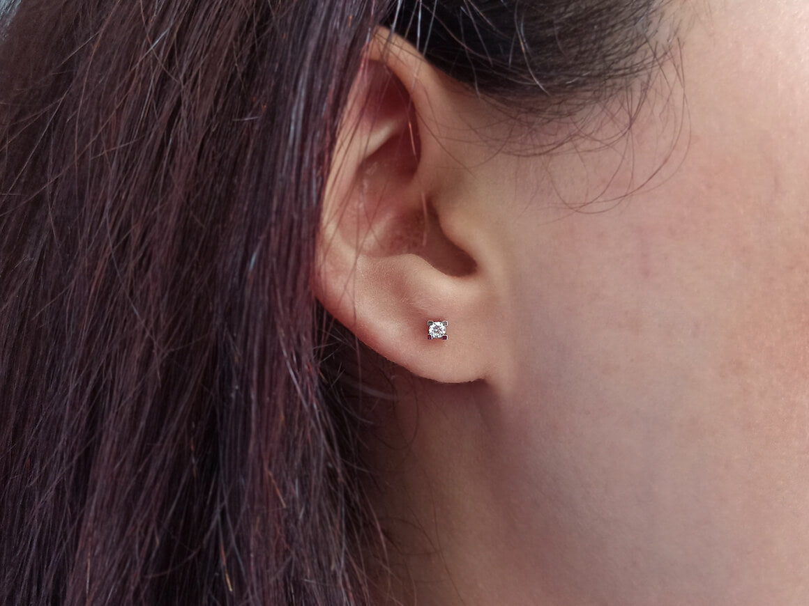 0.12 carat solitaire diamond stud earrings