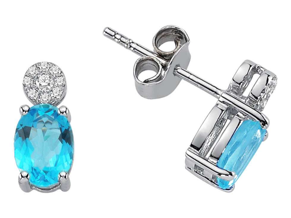 Boucles d'oreilles puces diamant et topaze bleue ovale