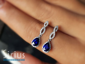 Boucles d'oreilles puces diamants et saphirs en forme de larme
