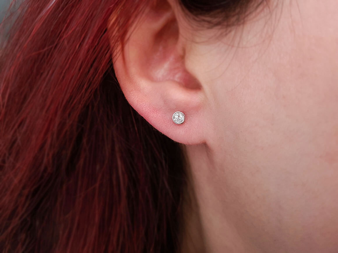0.16 carat solitaire diamond earrings