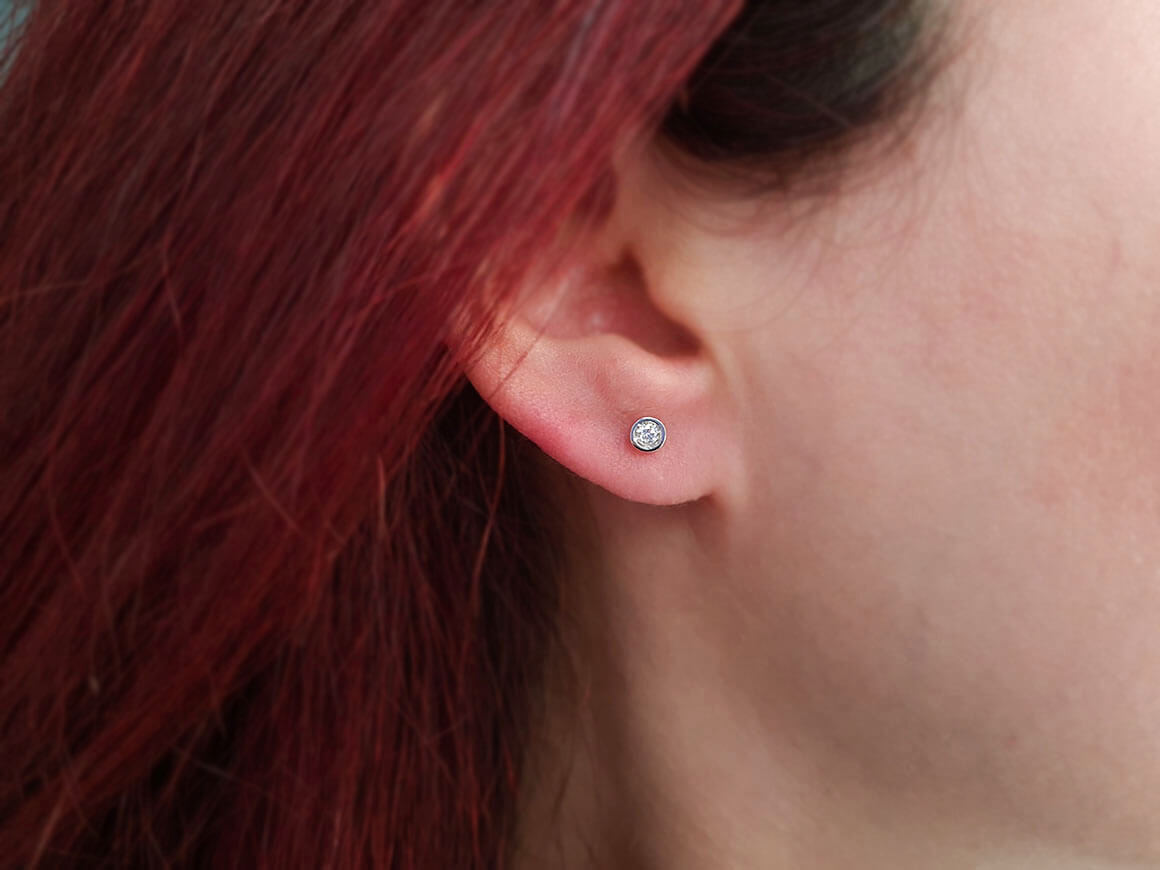 0.16 carat solitaire diamond earrings