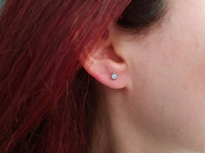 0.16 carat solitaire diamond earrings