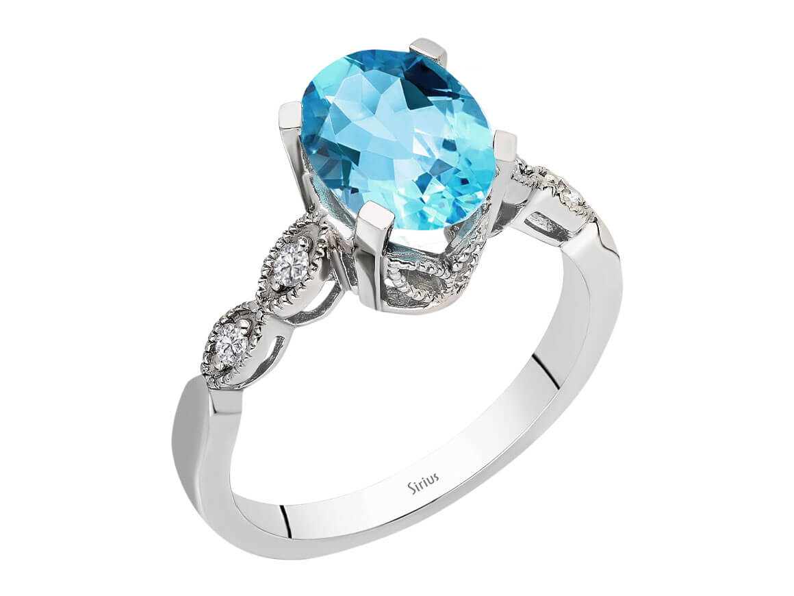 Diamond and Oval Blue Topaz Ring