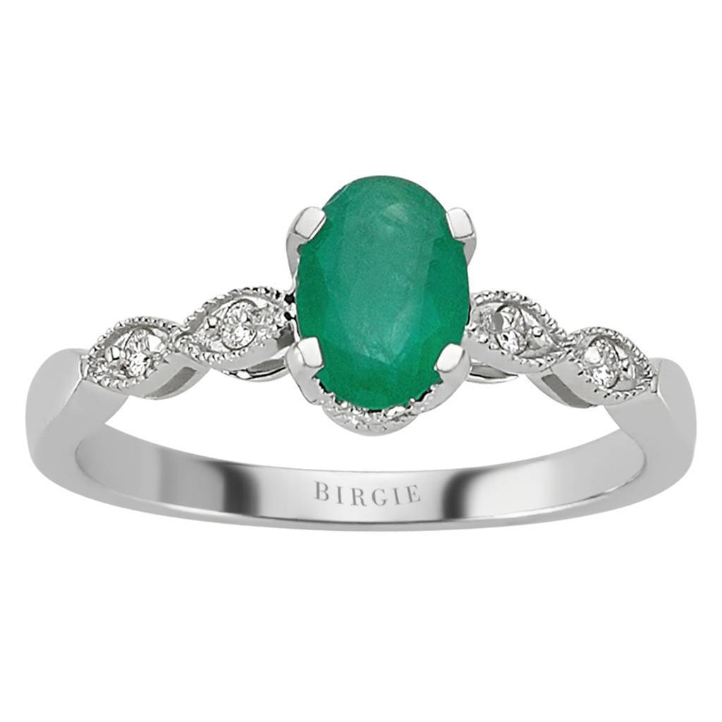 Bague ovale émeraude et diamants sertis à une griffe