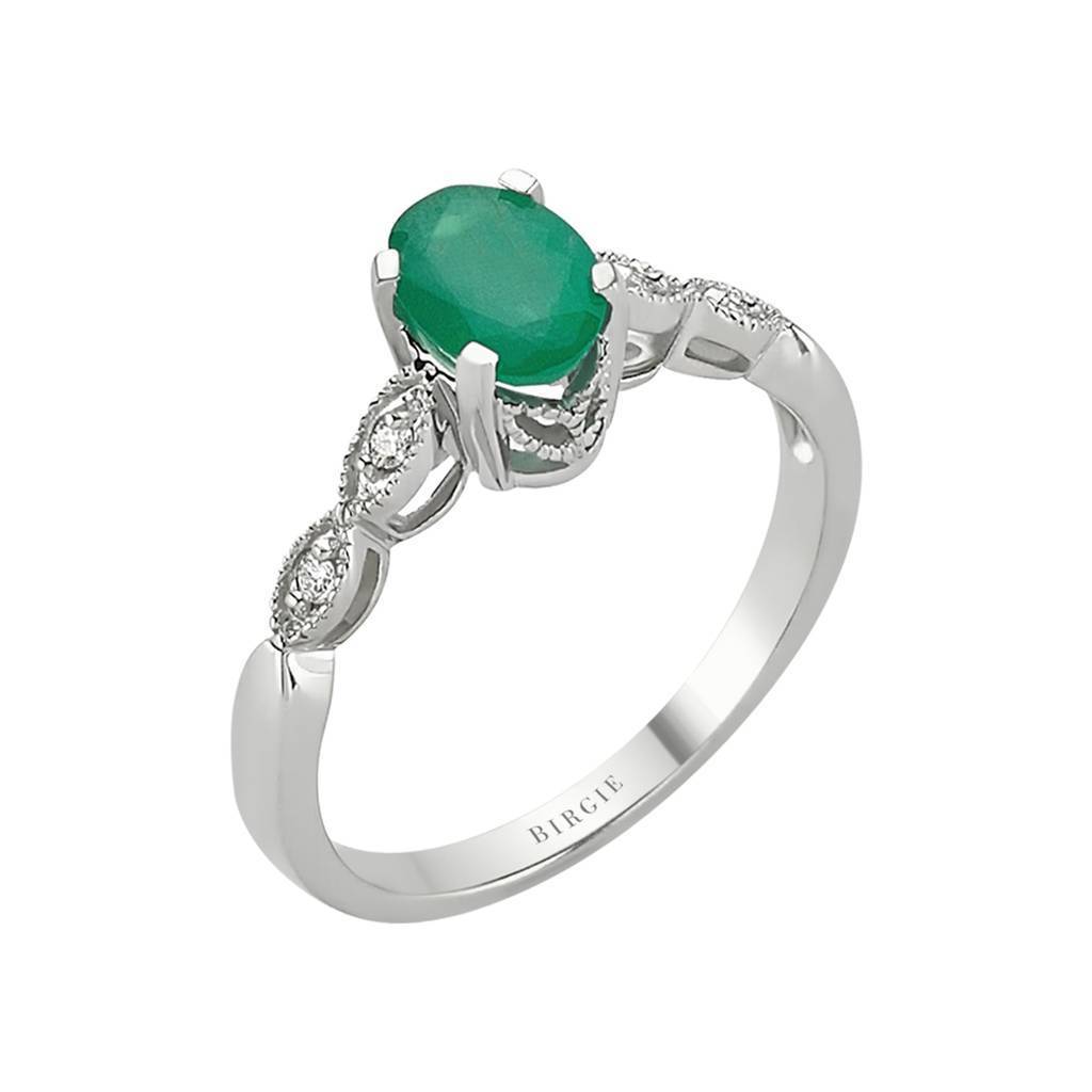 Bague ovale émeraude et diamants sertis à une griffe