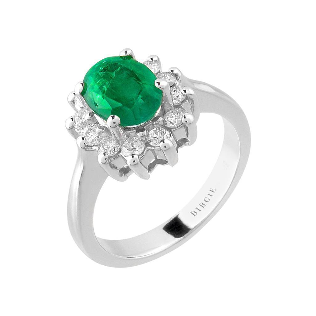 Bague d'entourage avec émeraude et grappe de diamants taille ovale