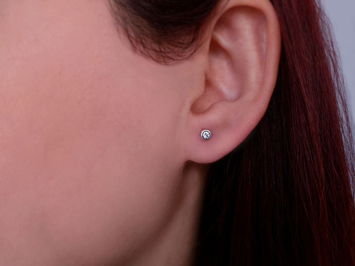 0.09 carat solitaire diamond earrings
