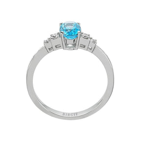Bague diamant et topaze bleue ovale