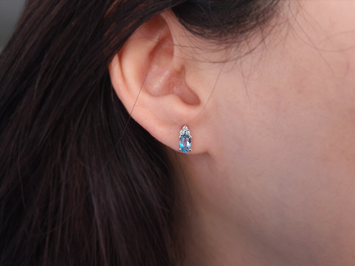 Diamond and Oval Blue Topaz Stud Earrings